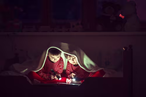 2 children in a cosy nook 
